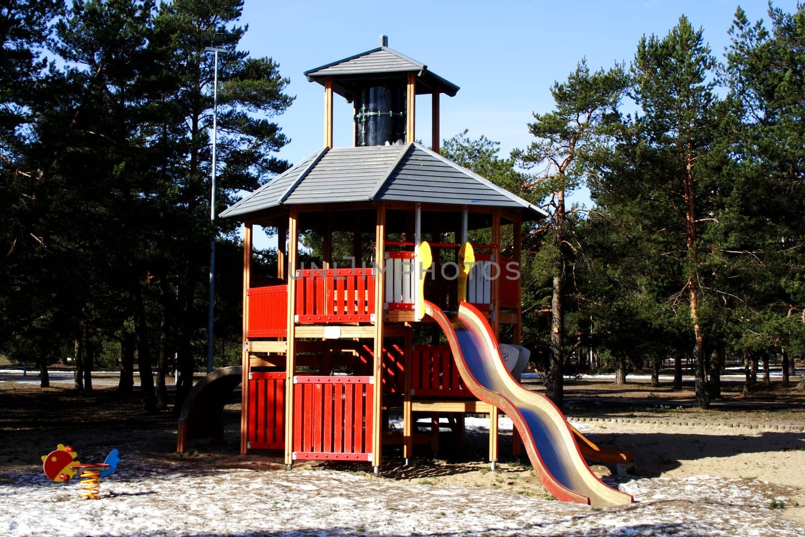 An image of a colorful children&#039 s playground in suburban area