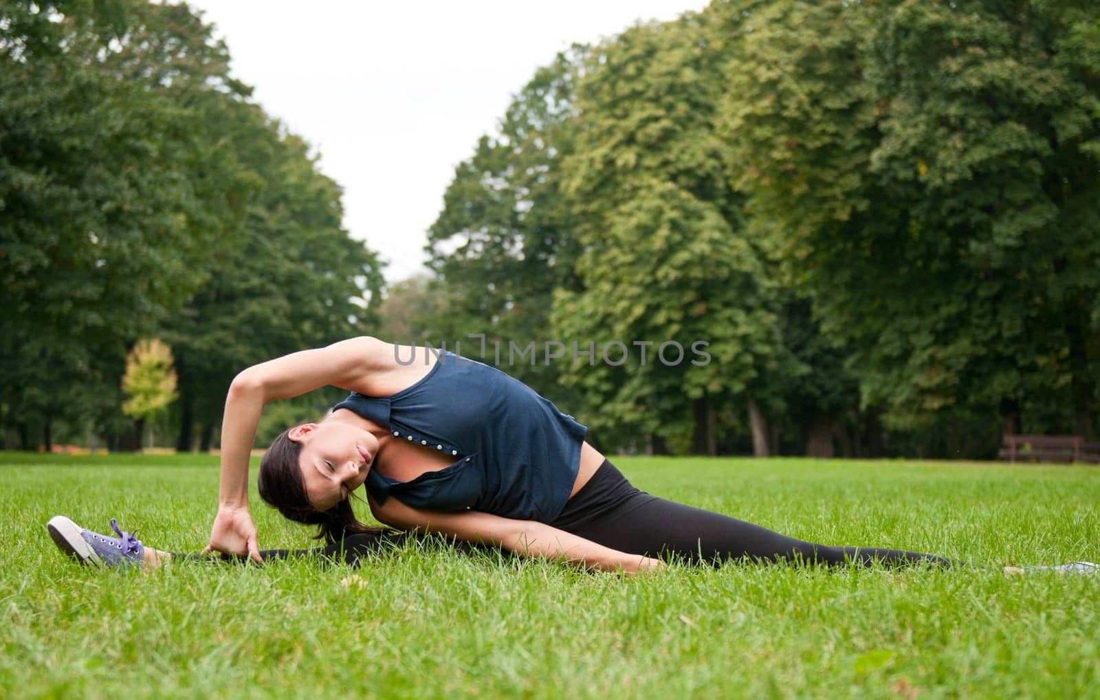 Woman stretching muscles before jogging