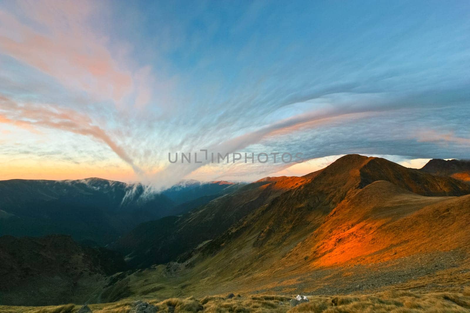 a mysterious cloud at sunrise on the mountain