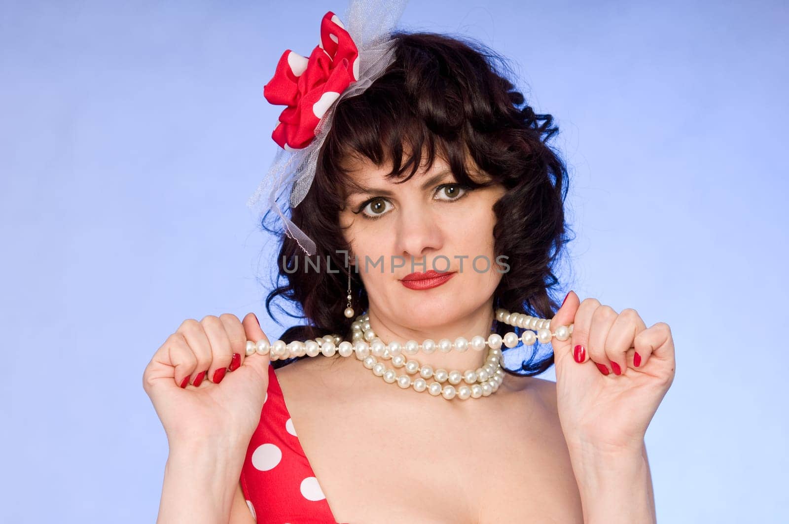 woman pin-up in red dress  on blue background