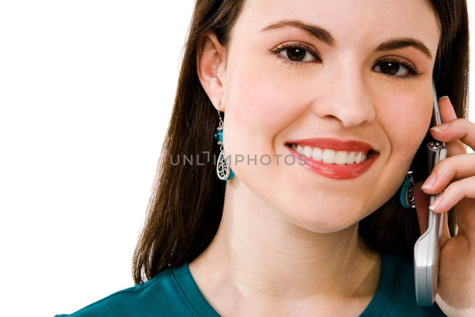 Portrait of a woman talking on a mobile phone isolated over white