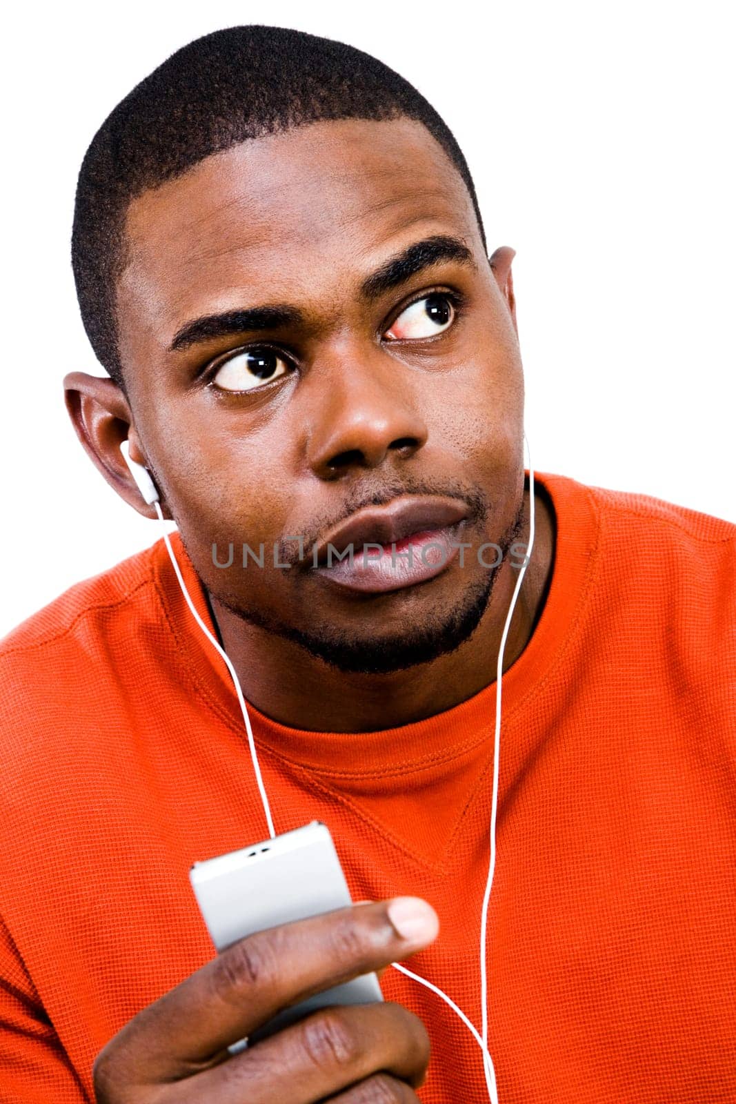 African man listening to music on a MP3 player isolated over white