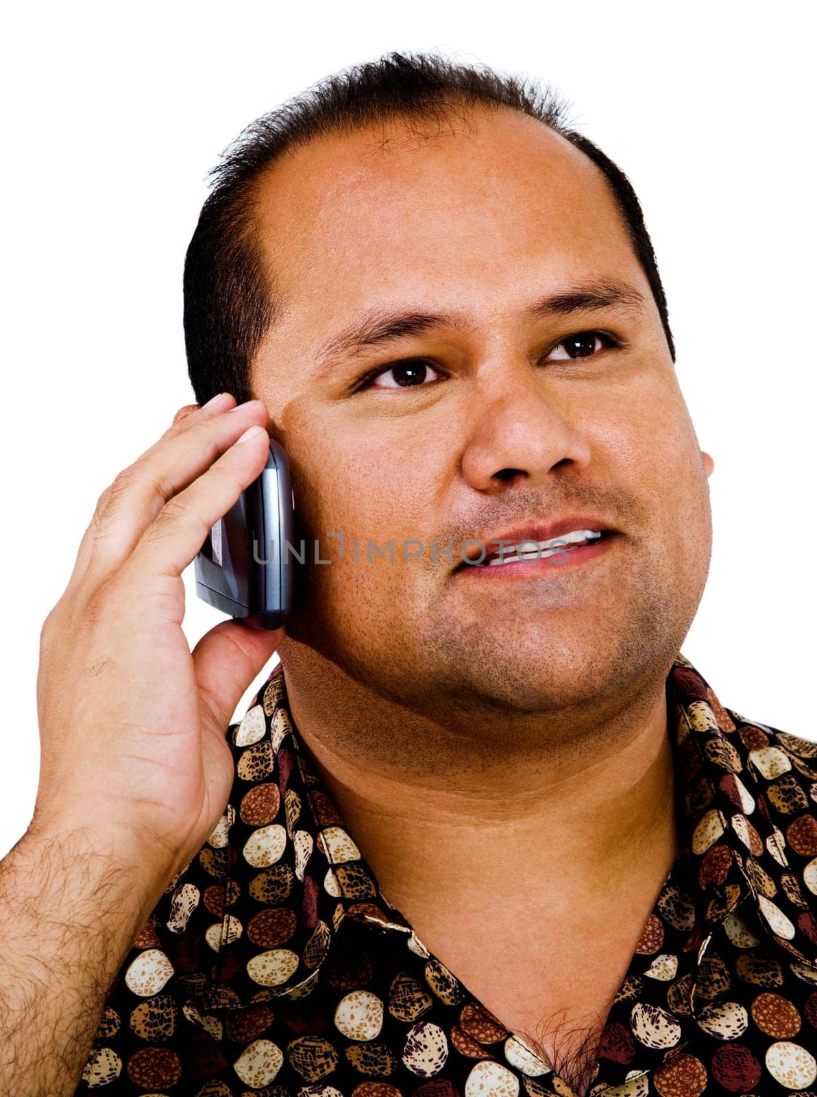 Mixedrace man talking on a mobile phone isolated over white
