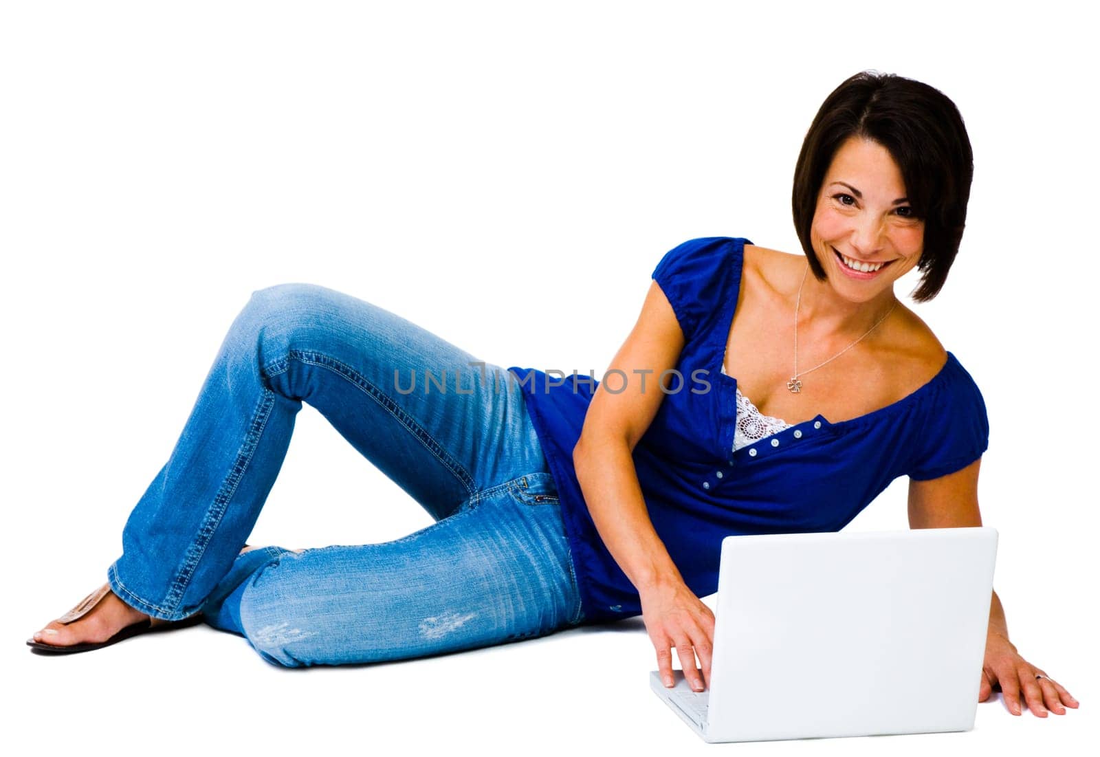 Woman using a laptop and smiling isolated over white
