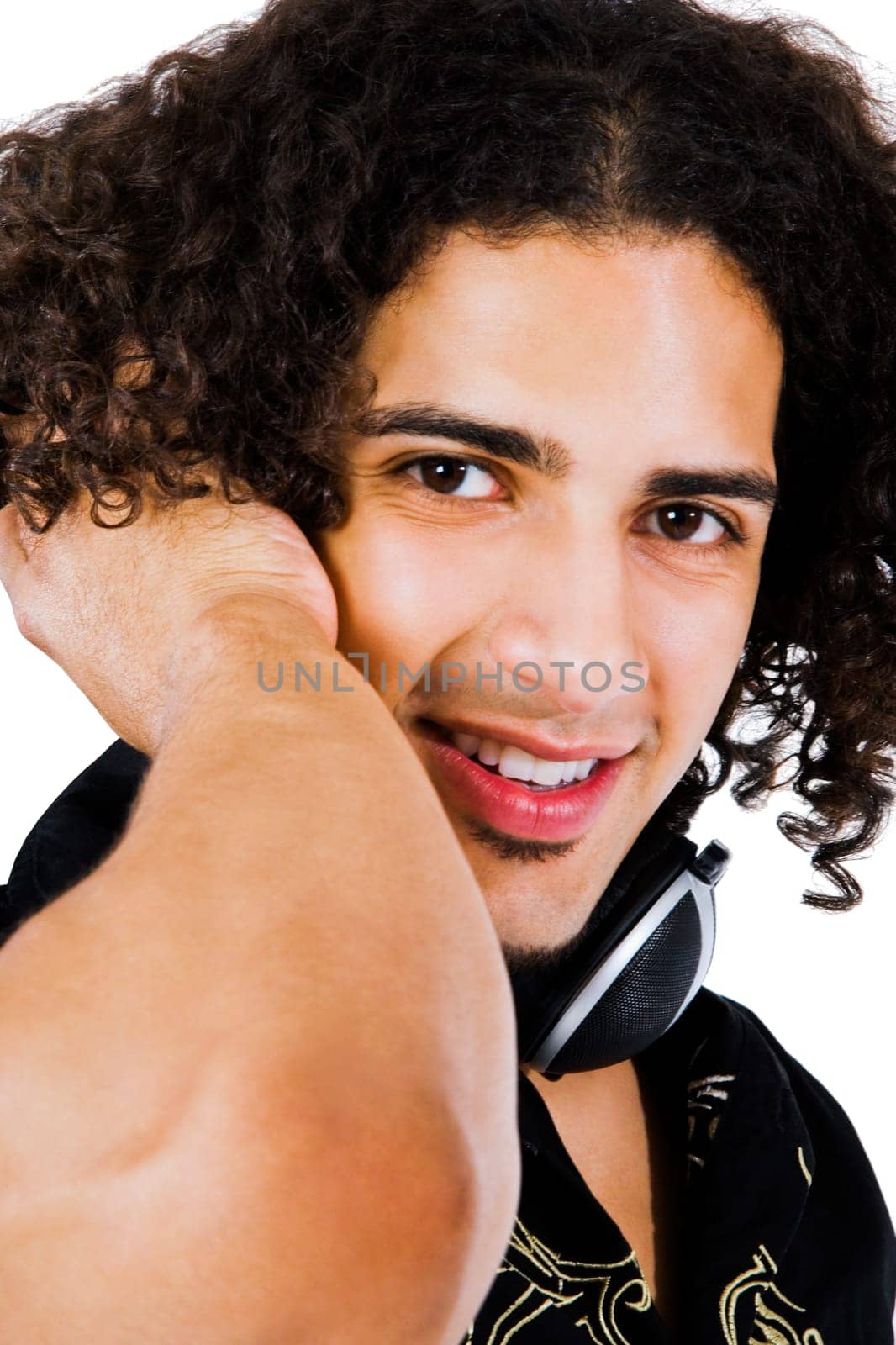 Fashion model wearing headphones and listening to music isolated over white