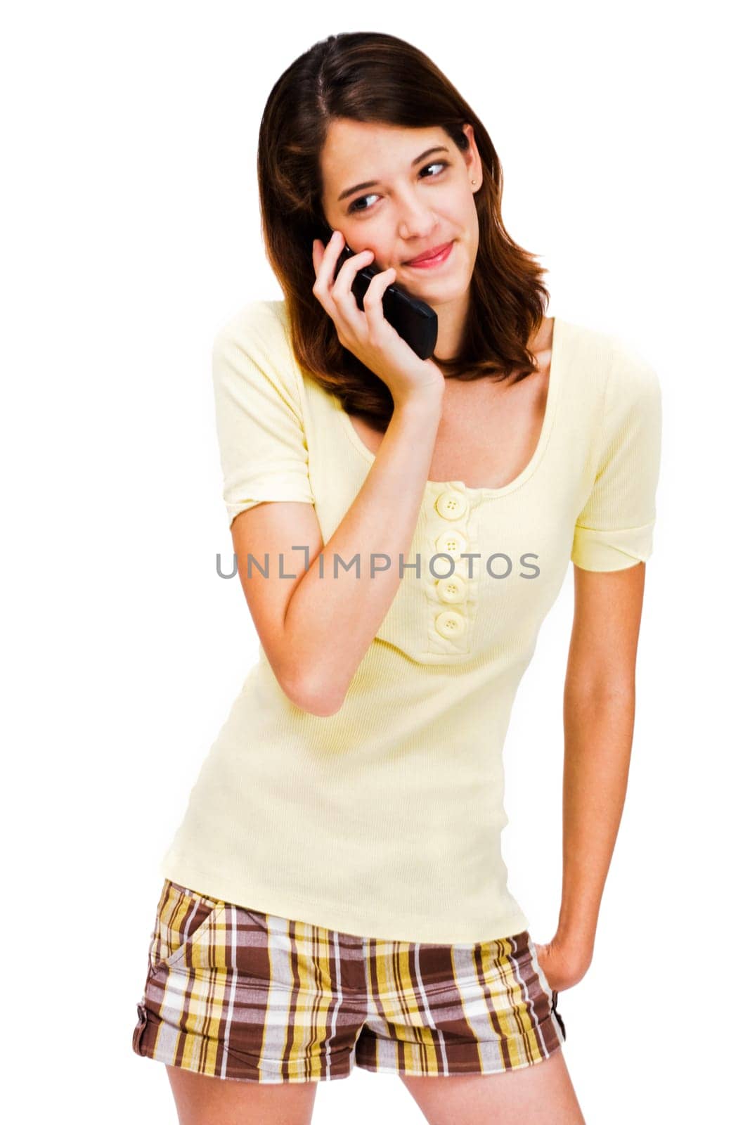 Young woman talking on a mobile phone isolated over white