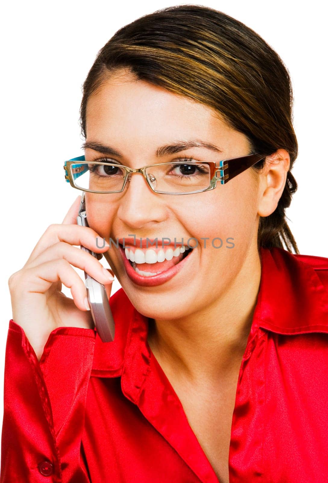 Businesswoman talking on a mobile phone and smiling isolated over white