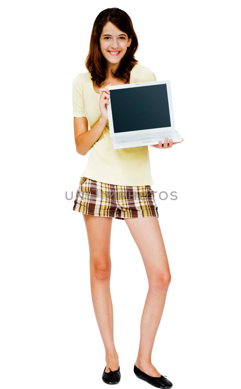 Portrait of a woman holding a laptop and smiling isolated over white
