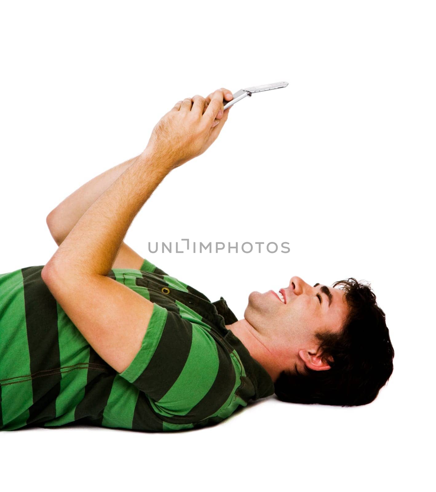 Smiling man text messaging on a mobile phone isolated over white