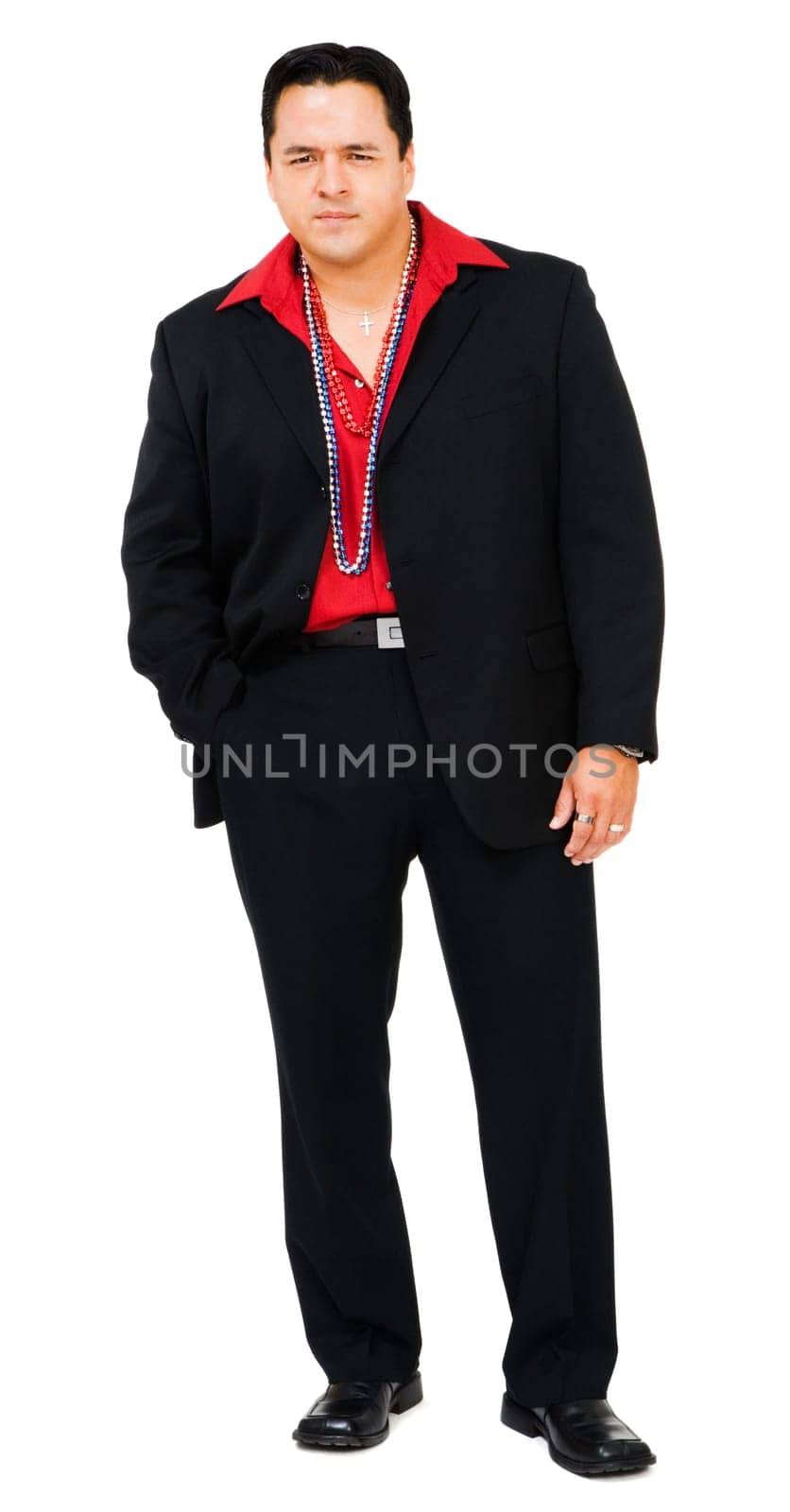 Mid adult man standing with his hands in his pockets isolated over white