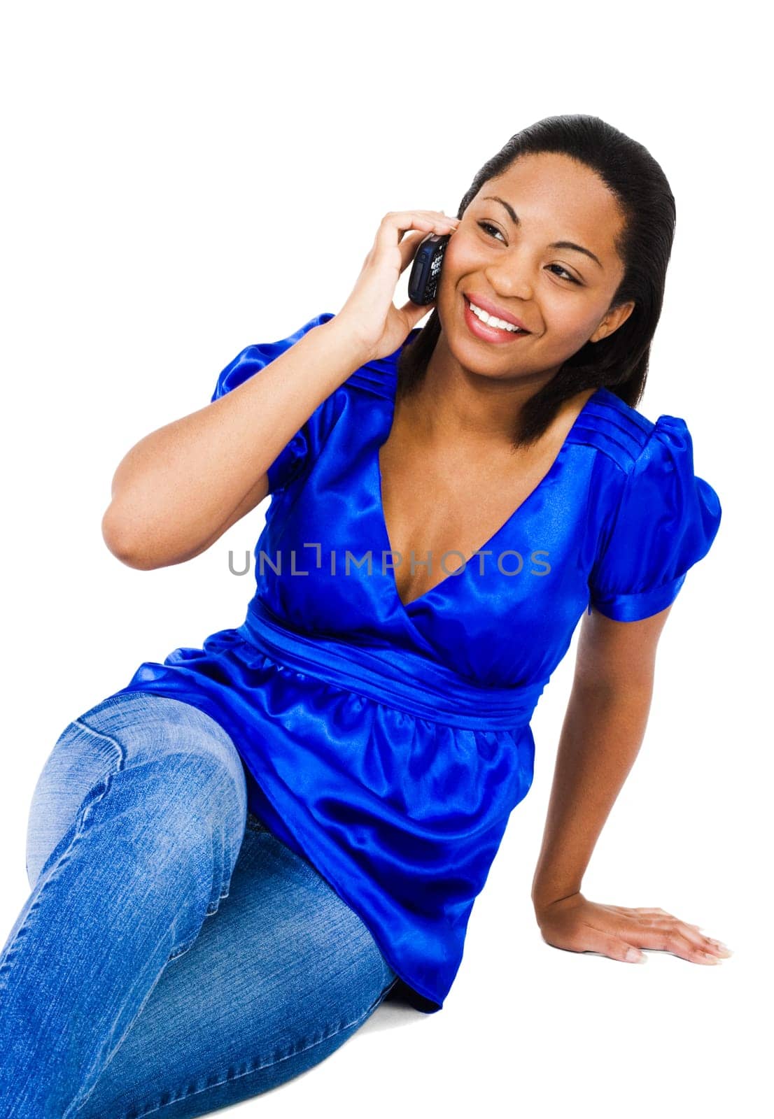 Happy woman talking on a mobile phone isolated over white