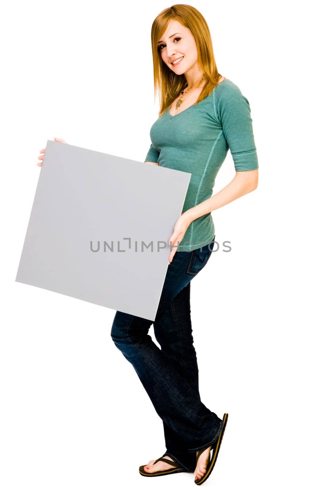 Mixedrace woman showing a placard and smiling isolated over white