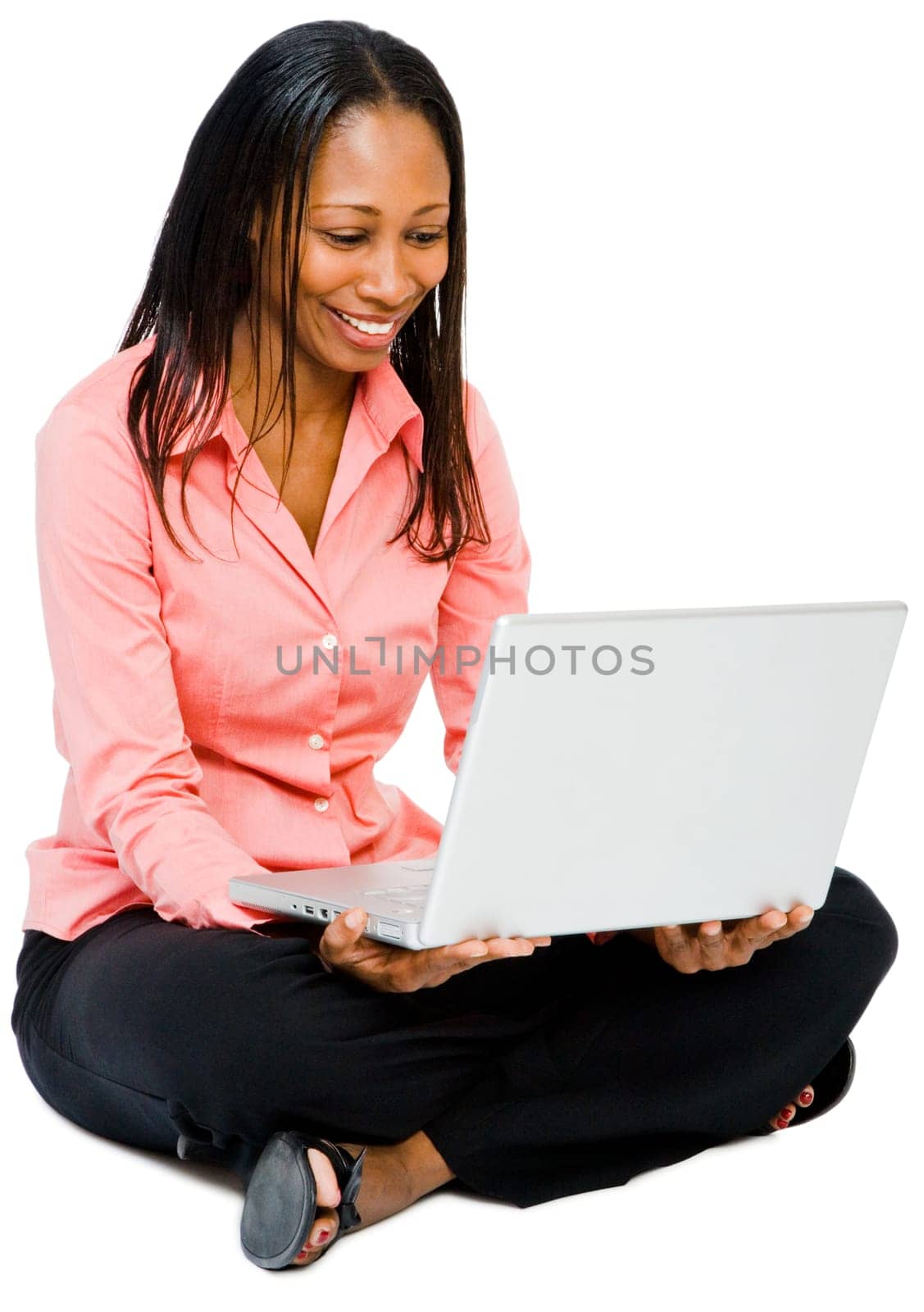 Close-up of a woman using a laptop and smiling isolated over white