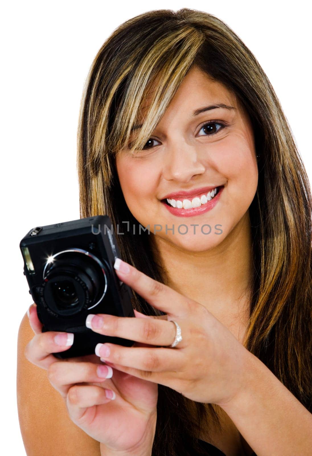 Young woman photographing with a camera and smiling isolated over white