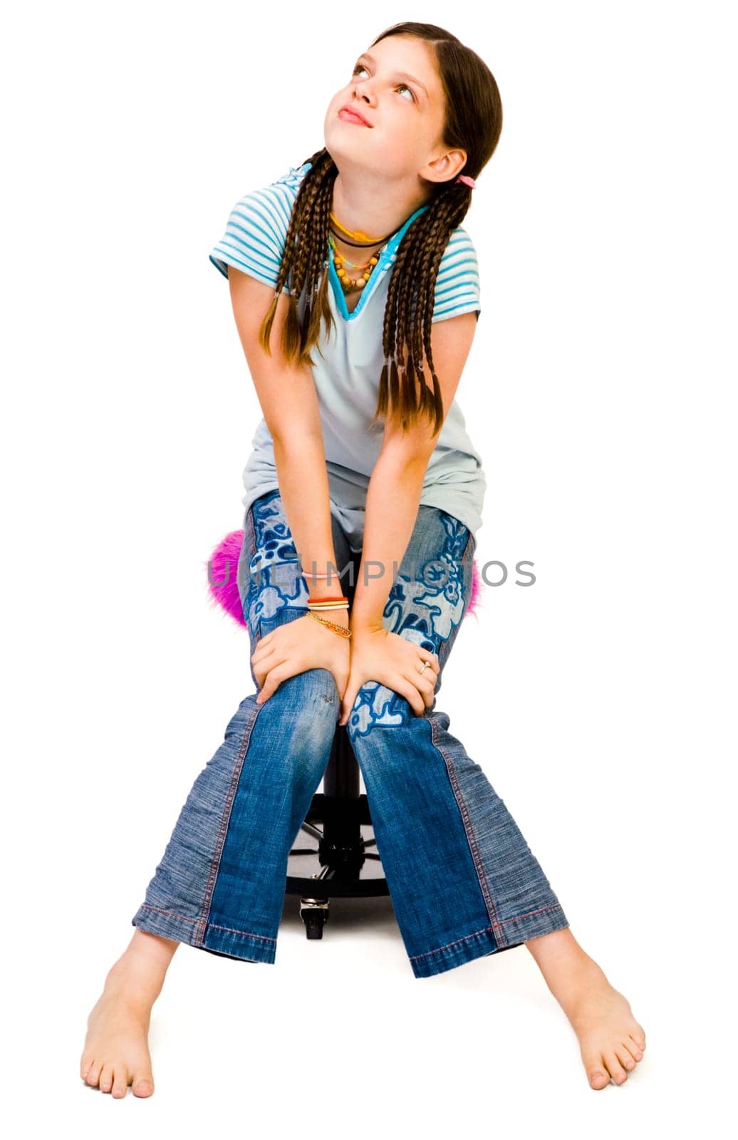 Girl sitting on a stool and day dreaming isolated over white