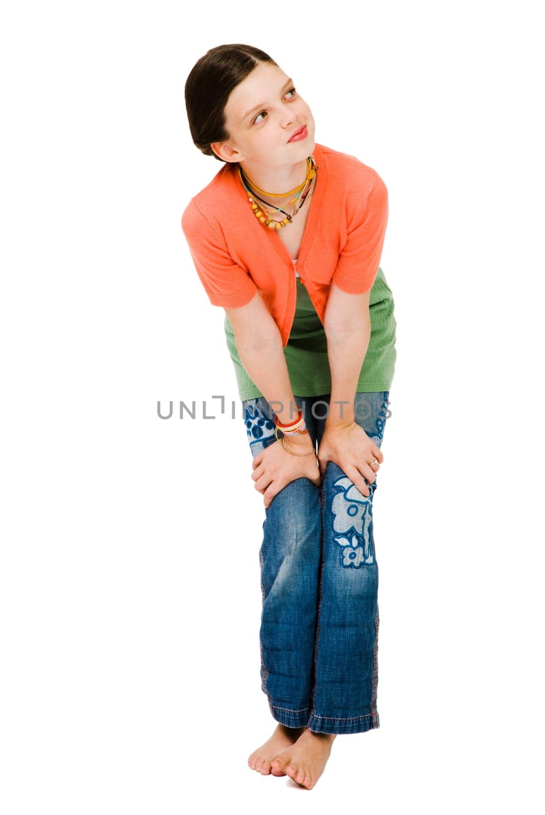 Caucasian girl day dreaming and smiling isolated over white