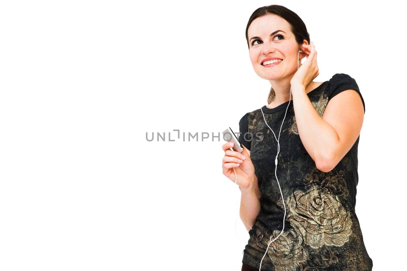 Woman listening to music on MP3 player isolated over white