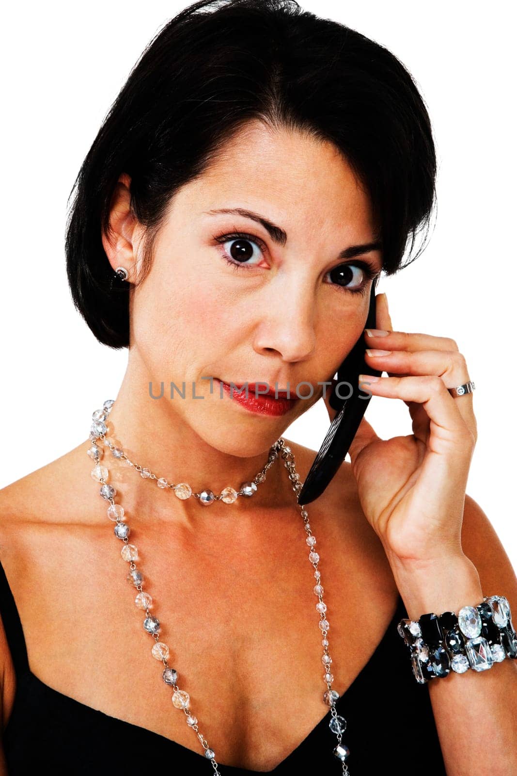Portrait of a woman talking on a mobile phone isolated over white