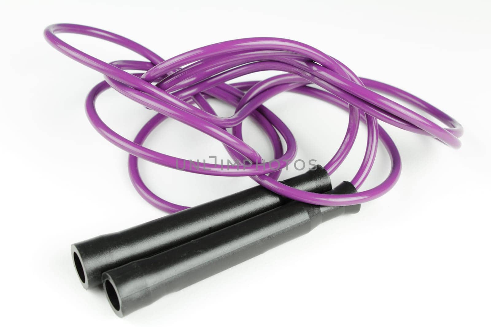 Black plastic handles with purple jump rope on a white background.