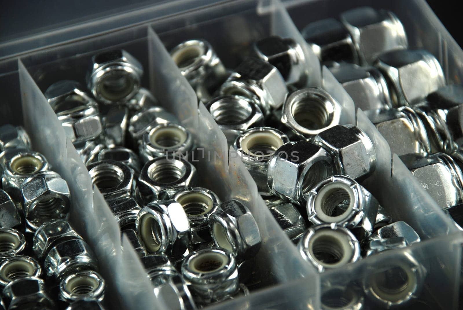 box containing several nuts and washers of different sizes