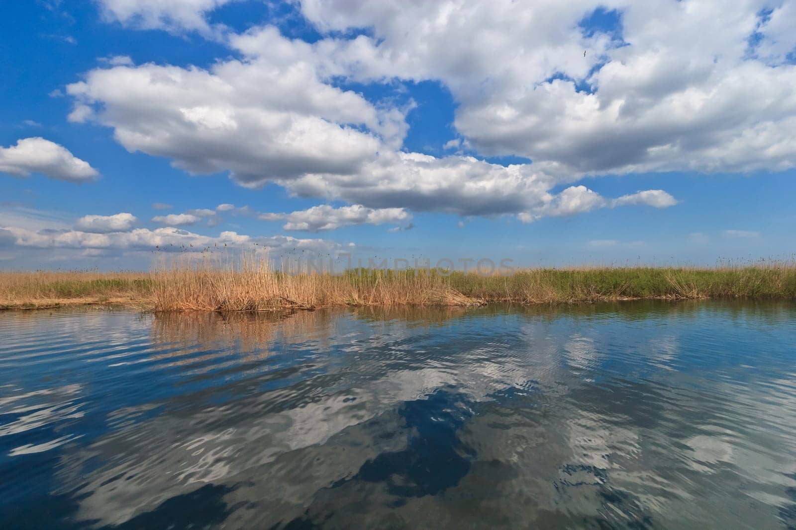 lake and clouds on a beautiful blue sky