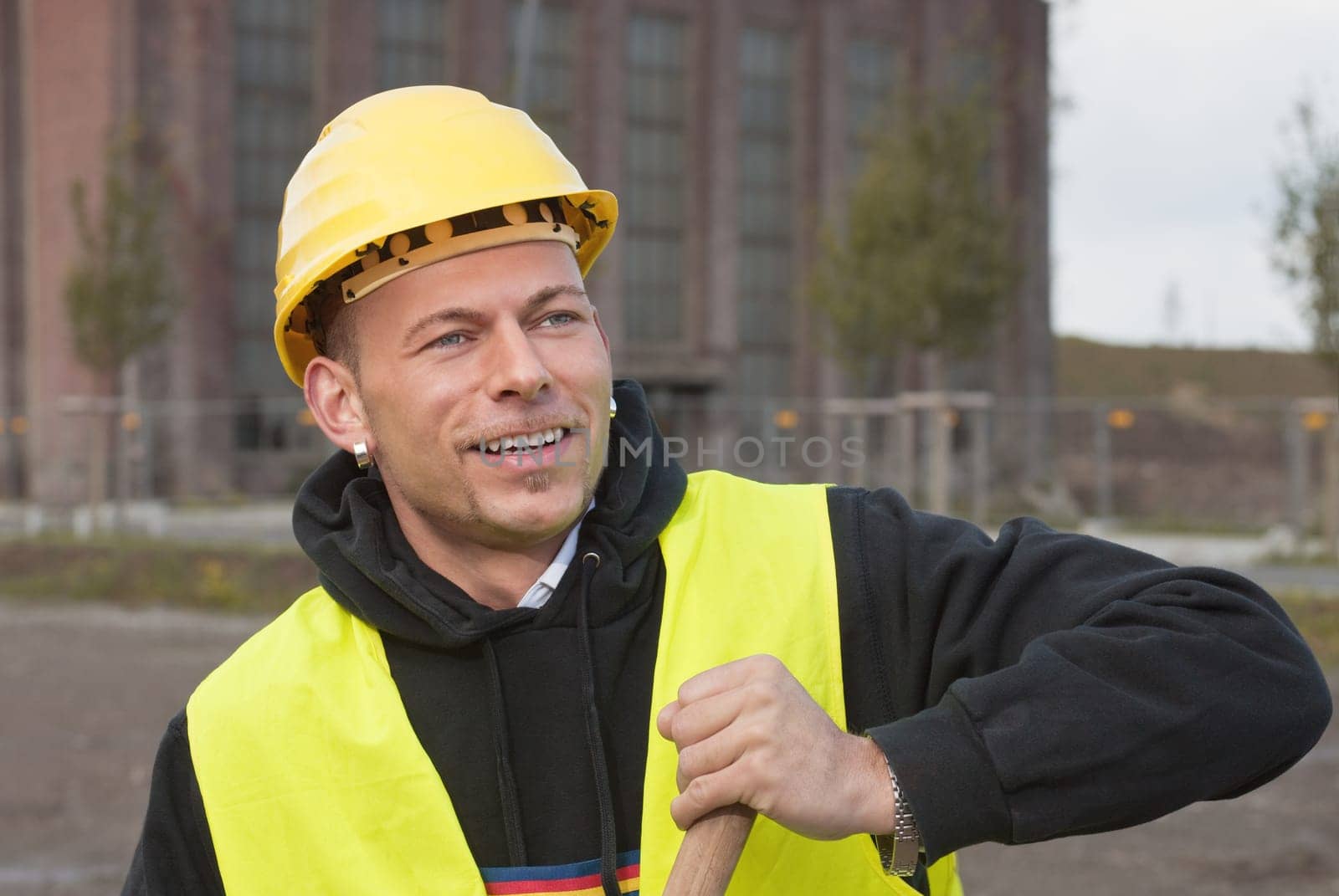 Smiling construction worker in yellow hard hat