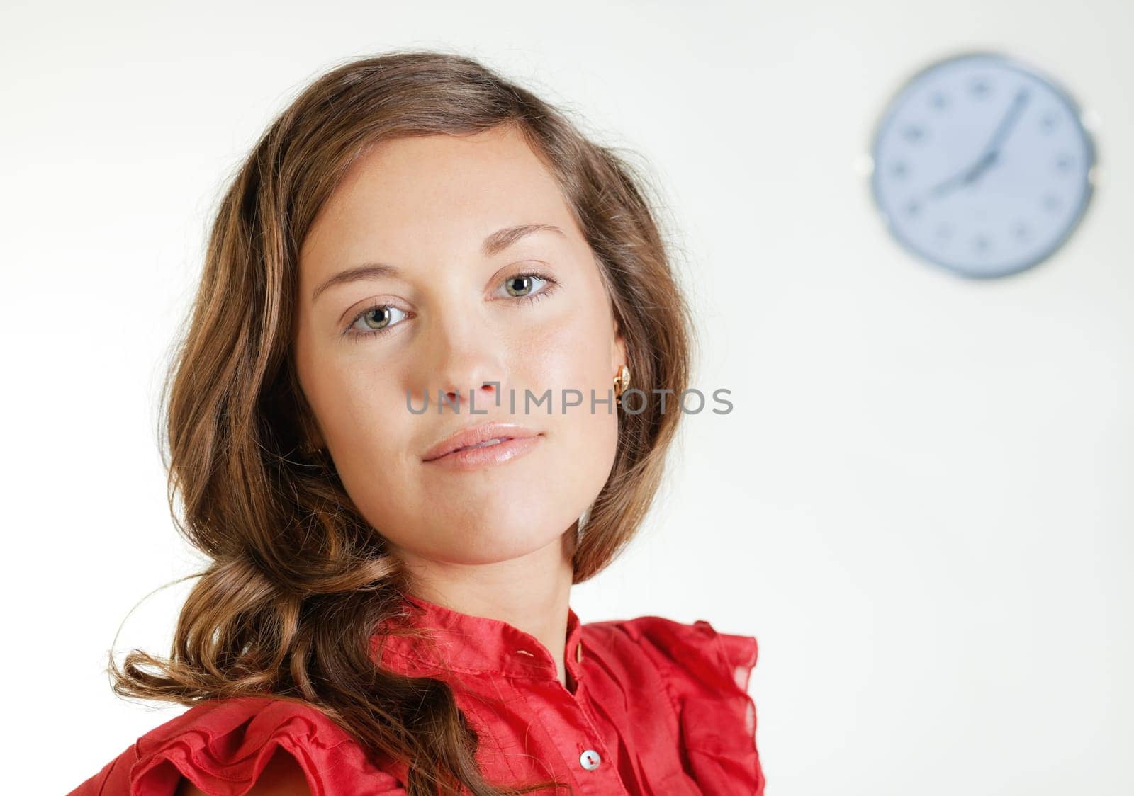 Portrait of pretty young blond woman in red dress