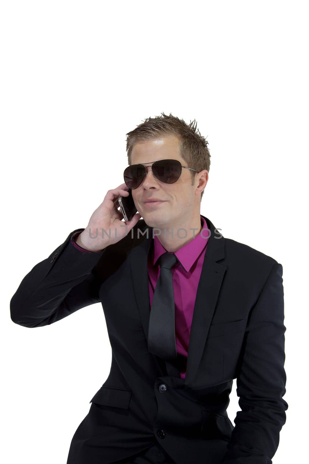 Young businessman holding a mobile phone