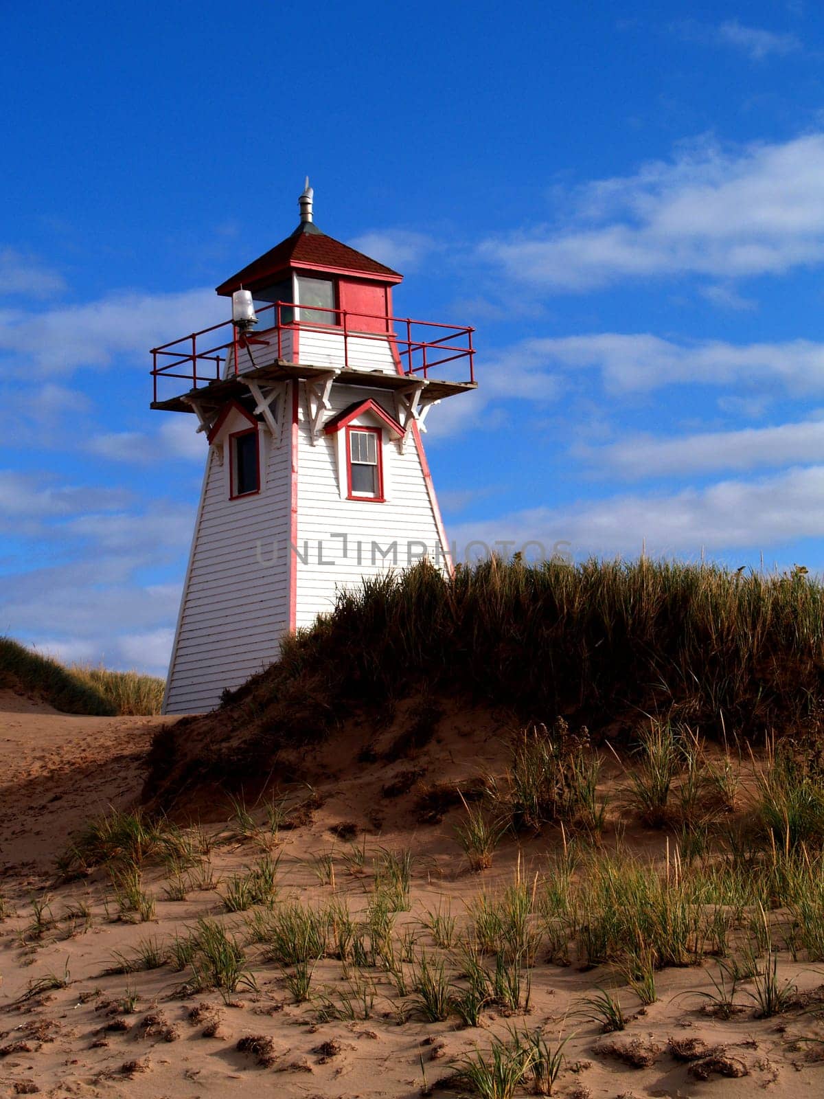 Red and white lighthouse on Prince Edward Island, Canada.