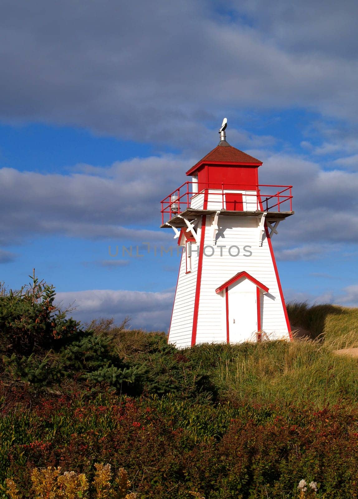 Red and white lighthouse on Prince Edward Island, Canada.