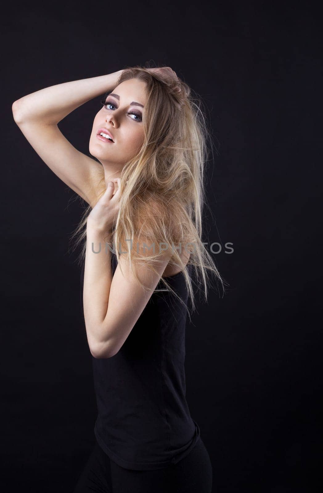 Young beauty blond girl look at you
