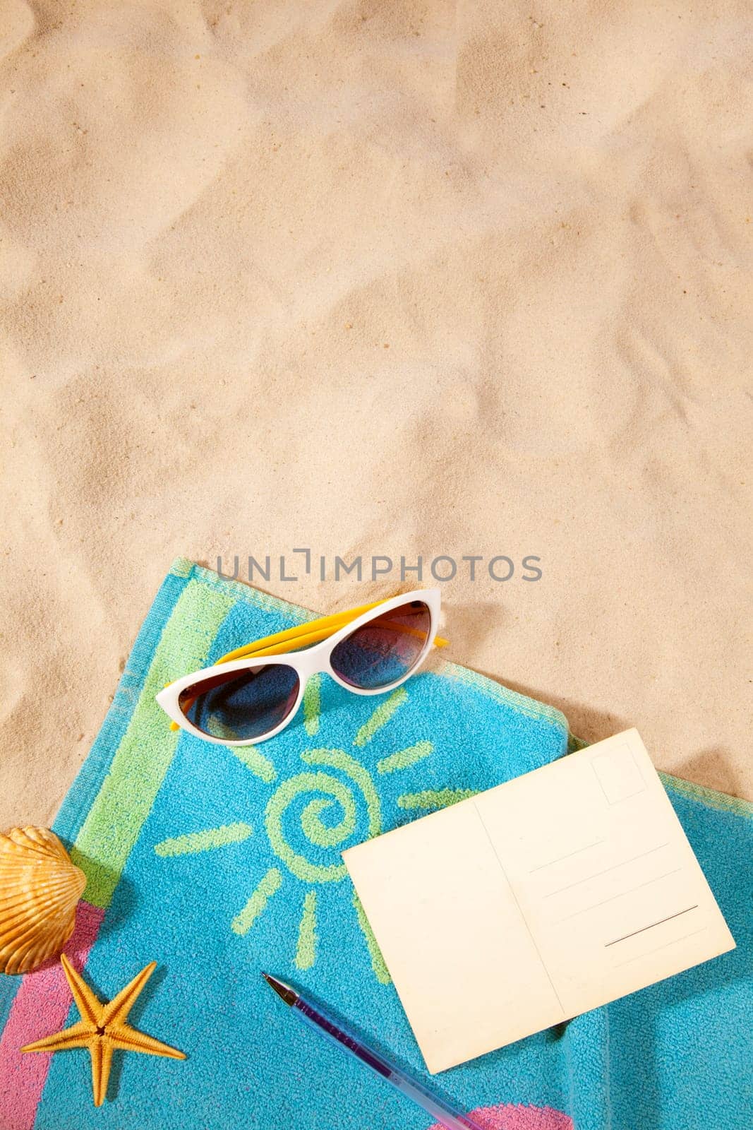 beach items  on a towel with copy-space