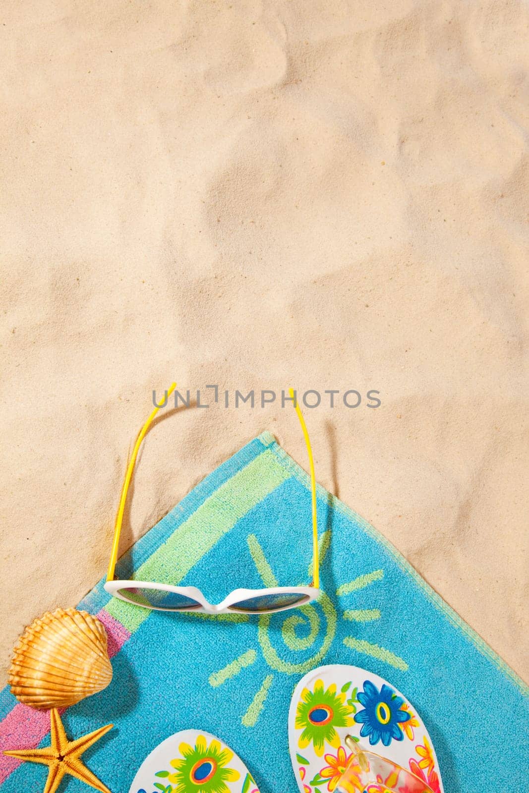 beach items  on a towel with copy-space