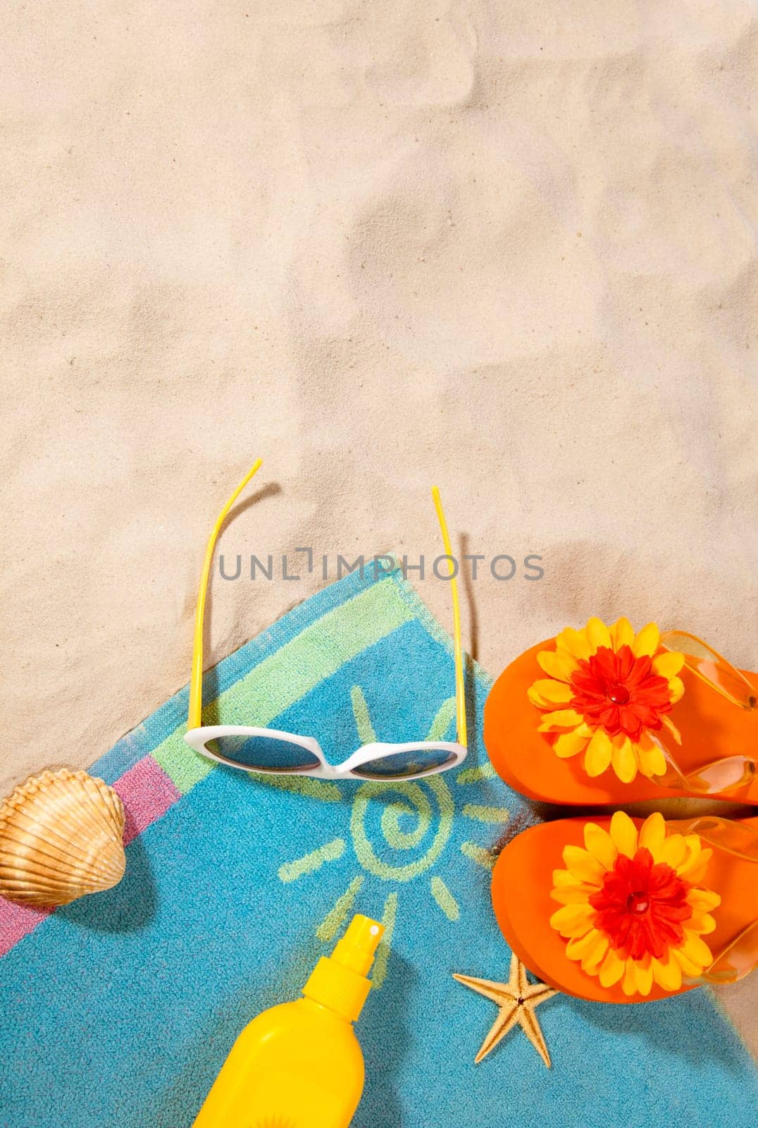 beach items  on a towel with copy-space