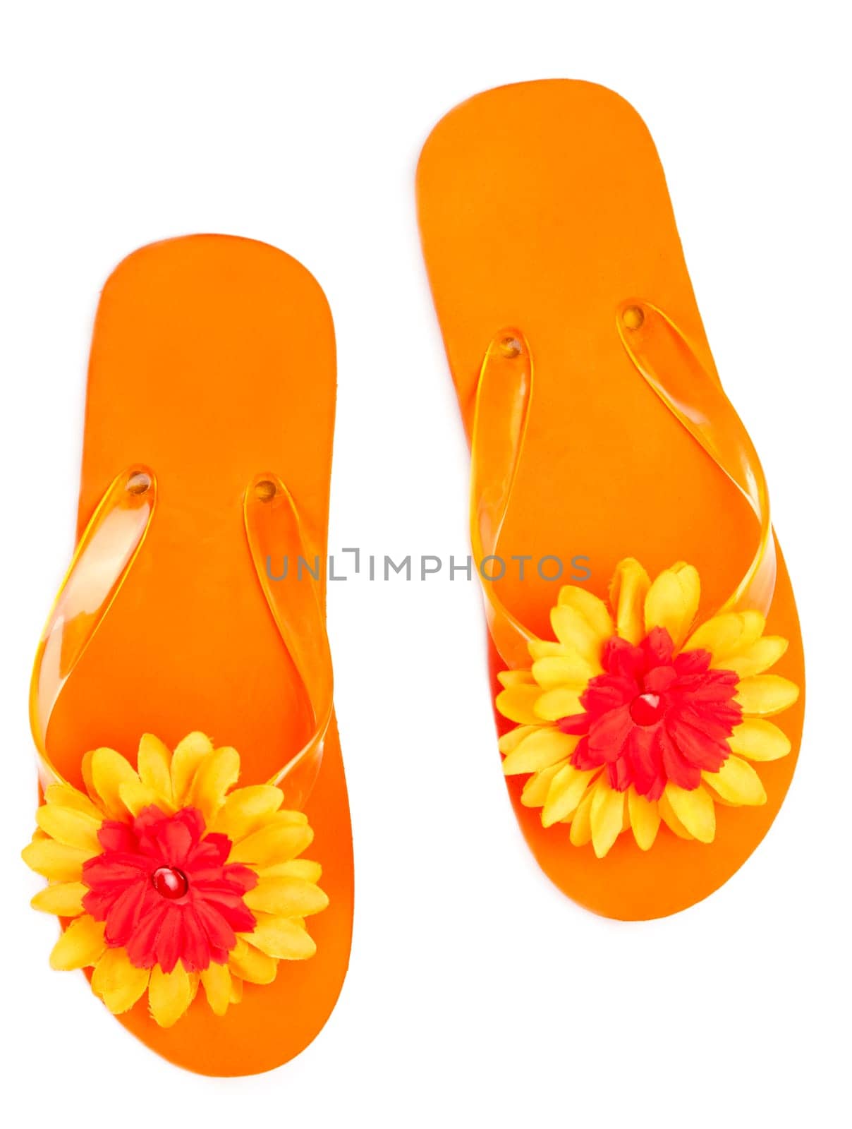 orange flip-flops with flowers on a white background