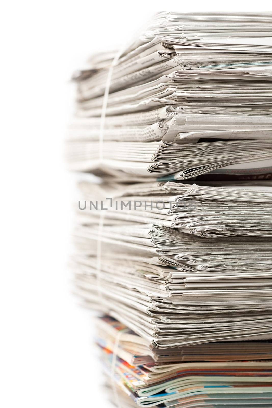 Big stack of newspapers on white background