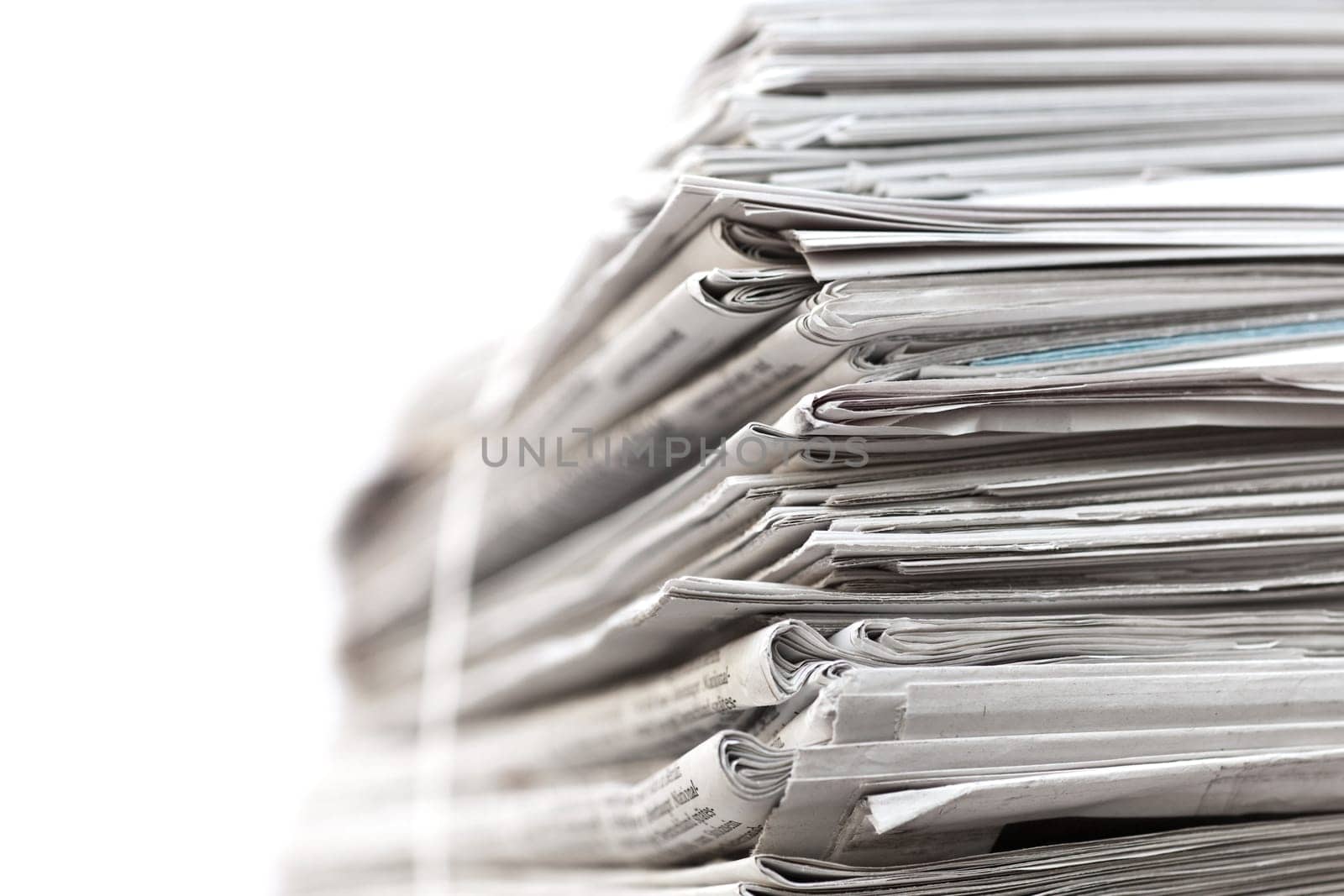 Big stack of newspapers on white background