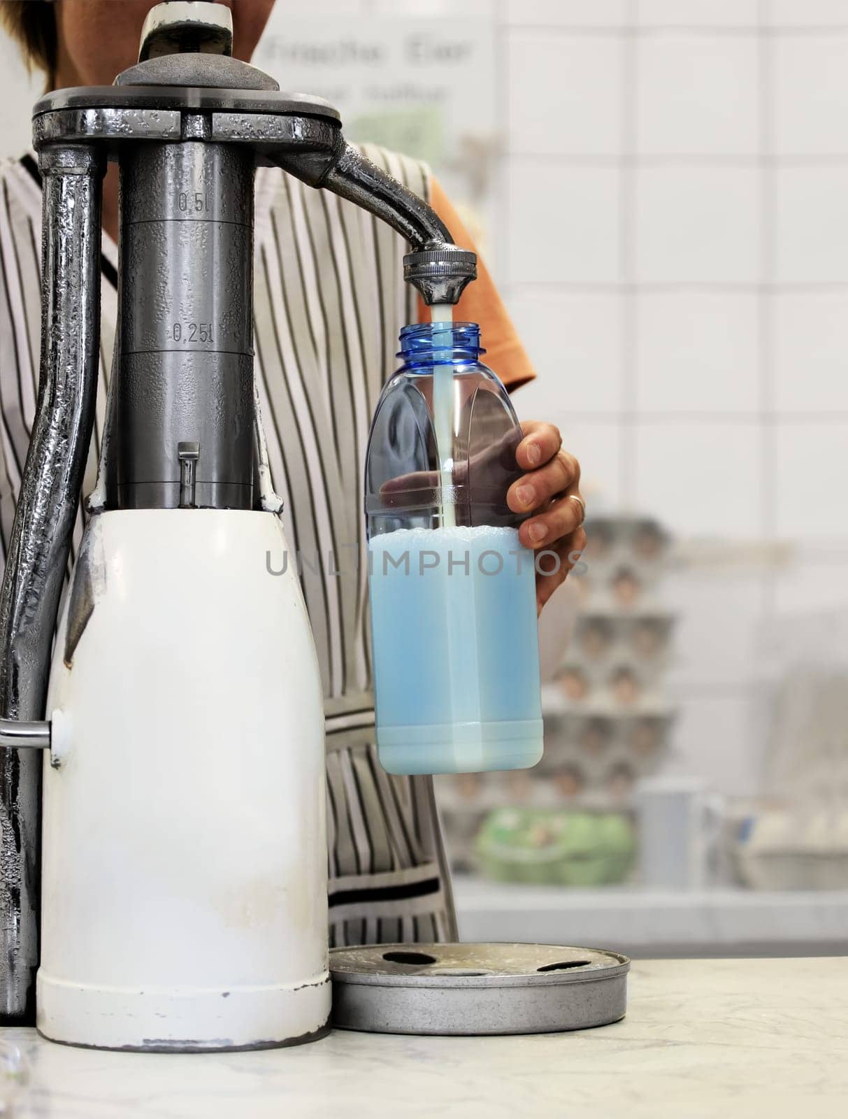 Fresh Bottle Milk from Milkpump in Dairy Farm Shop