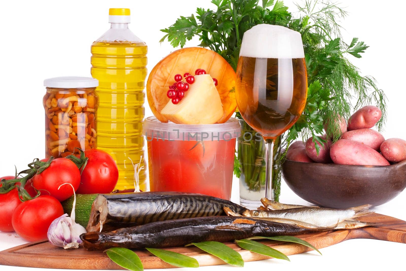 Arrangement of smoked Fish and Ingredients with glas Beer. Isolated on white