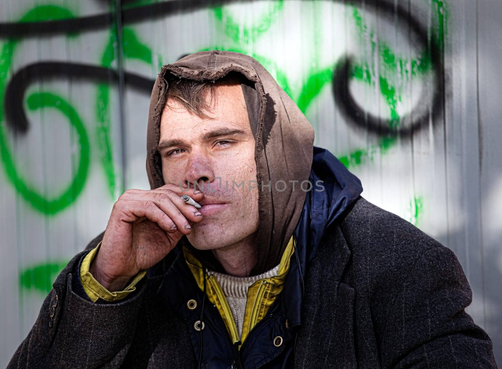 Homeless Men Being Friendly smokes a cigarette Outdoor