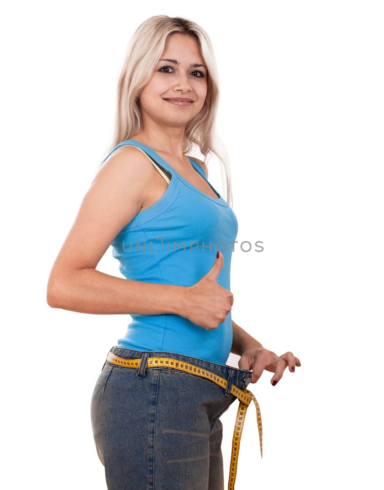 Young happy woman measuring her waist over white background