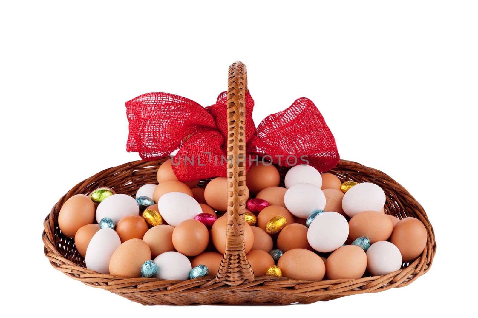 Easter Hens eggs in a basket with red Ribbon isolated on white