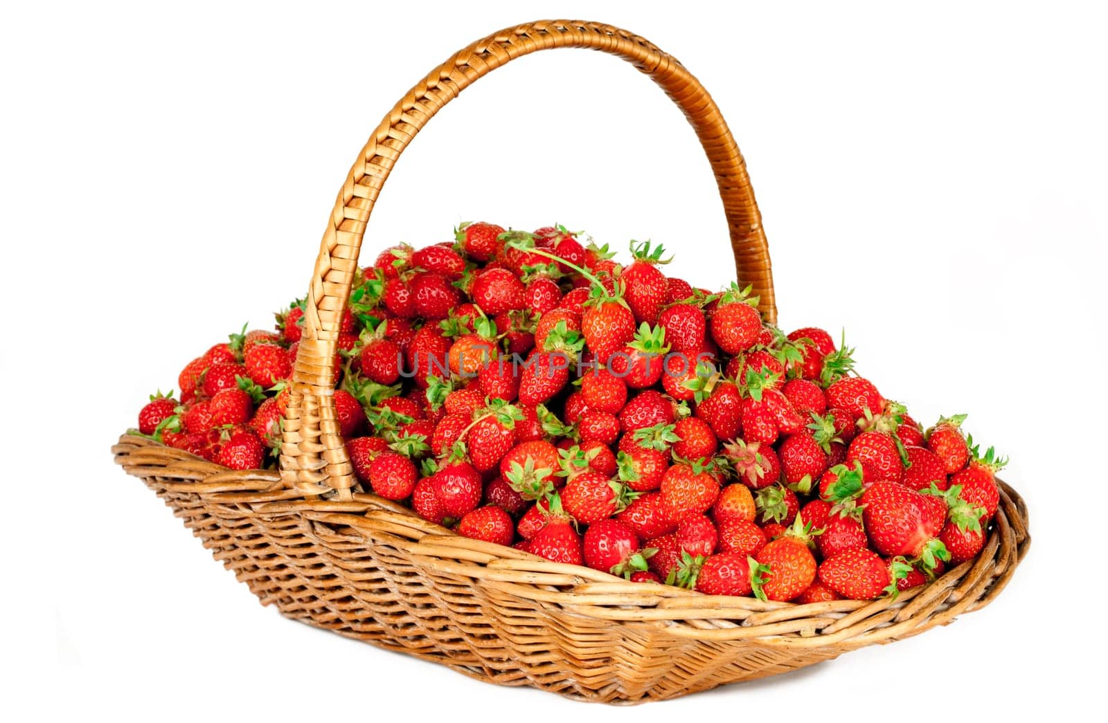 Strawberries in basket isolated on white