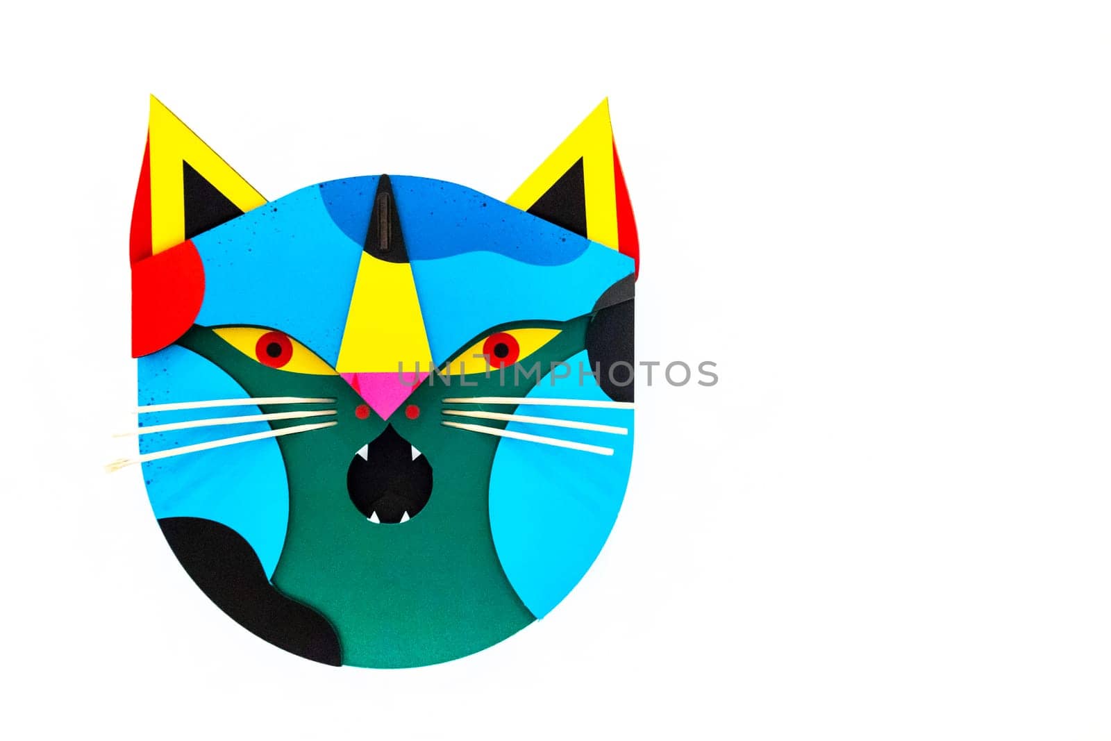 Colorful paper cat mask isolated on a white background. Halloween or carnival concept. Funny. Copy space.