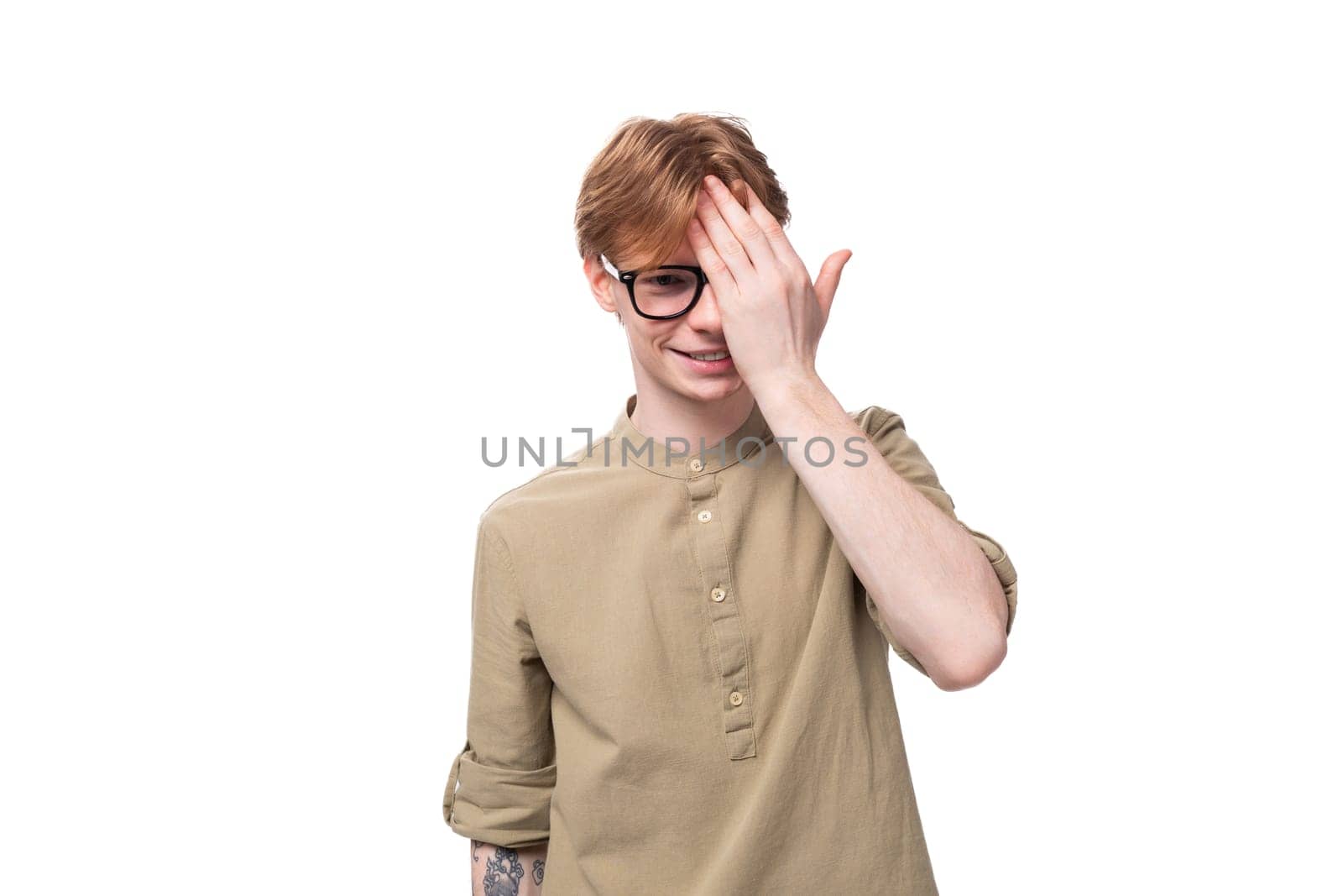 portrait of a slender red-haired man with glasses dressed in a brown shirt by TRMK