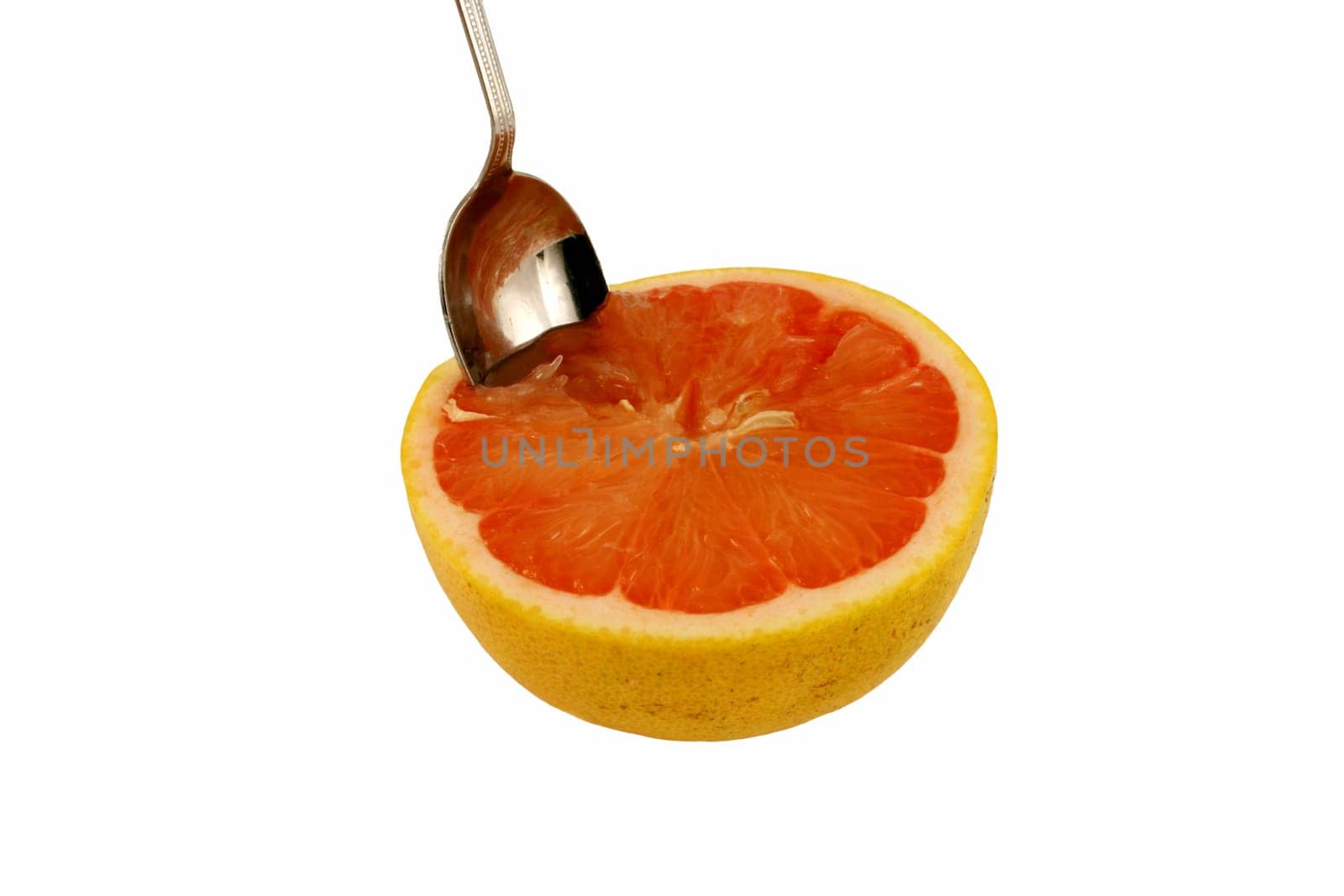 A Isolated pink grapefruit half with spoon