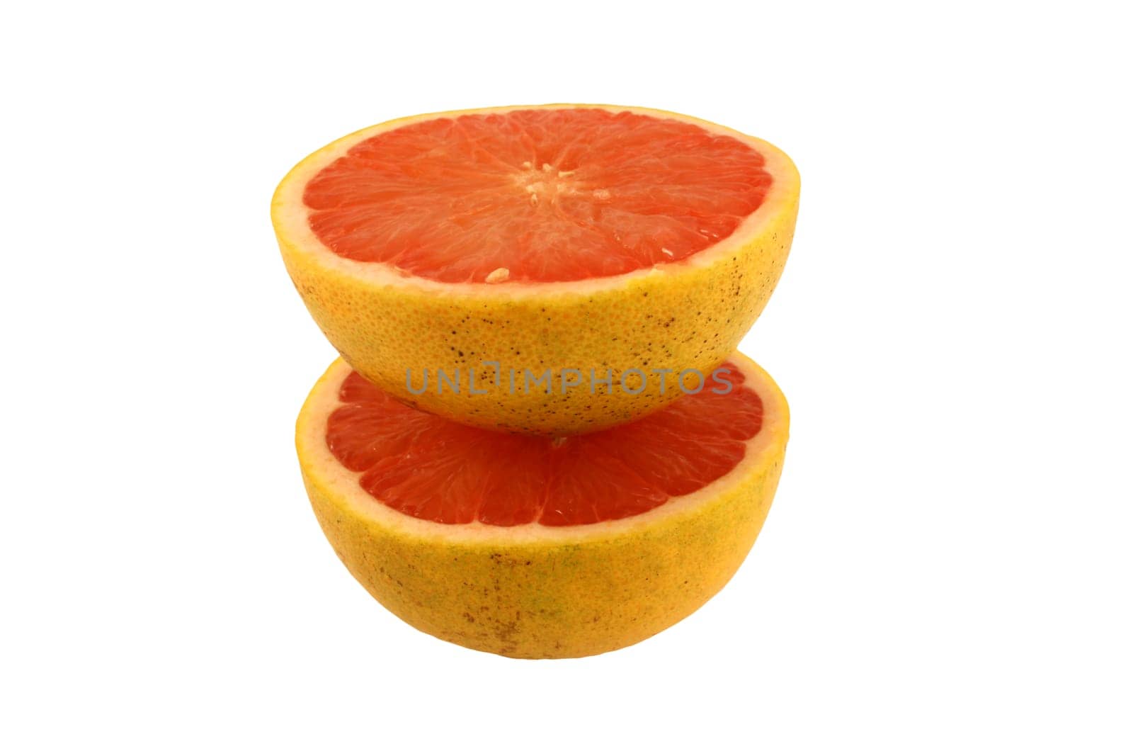 A Isolated pink grapefruit halveson white
