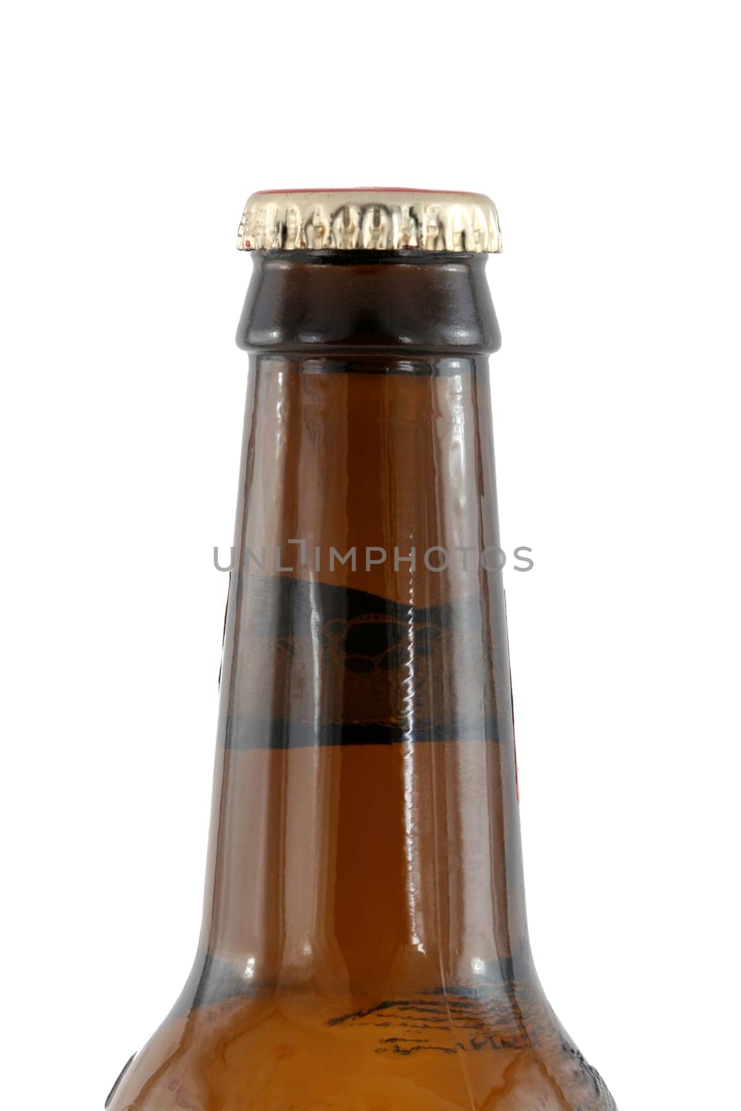 A Isolated brown beer bottle with cap