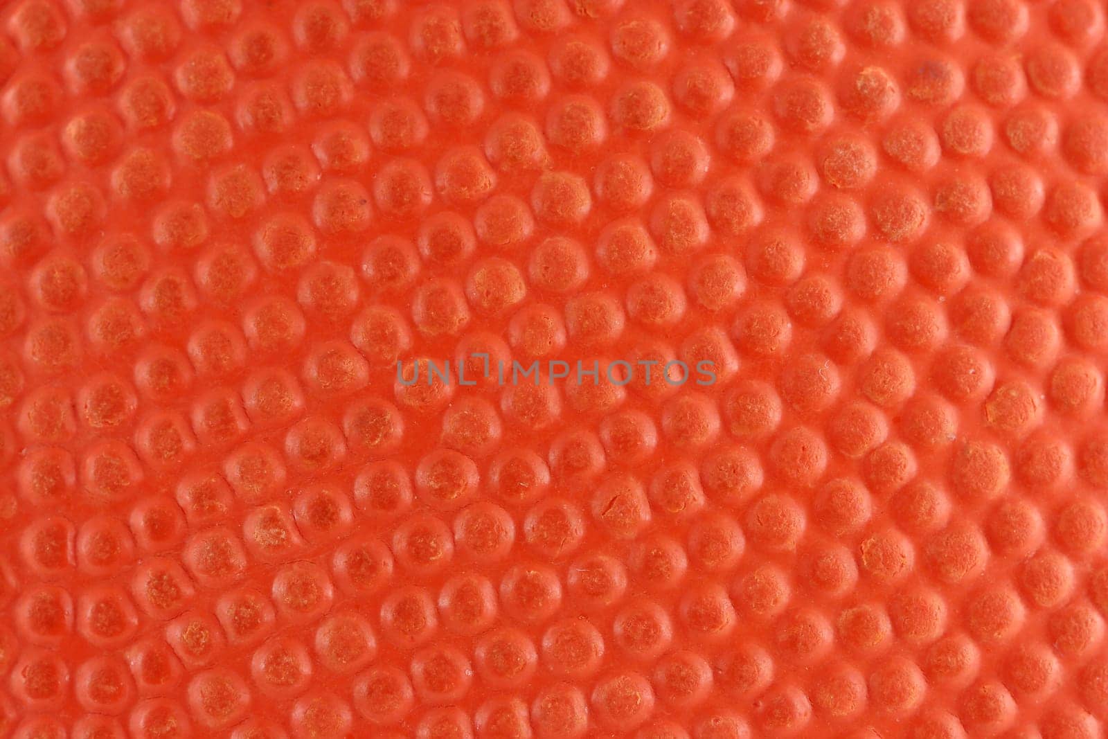 A Orange rubber basketball macro background