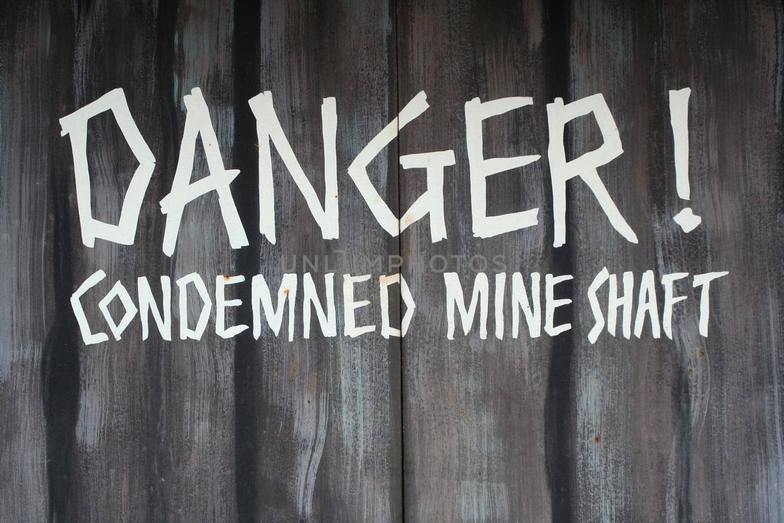 A Danger condemned mine shaft sign